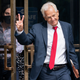 Former Trump White House official Peter Navarro gestures, Friday, June 3, 2022, as he leaves federal court in Washington. Navarro was indicted Friday on contempt charges after defying a subpoena from the House panel investigating the Jan. 6 attack on the U.S. Capitol. (AP Photo/Jacquelyn Martin)